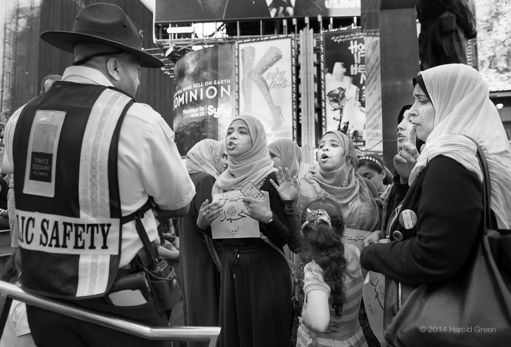 Confrontation Times Square, New York City © 2014 Harold Green.